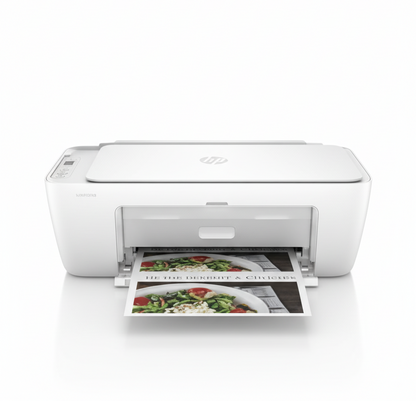 White printer on a white background with printed photos